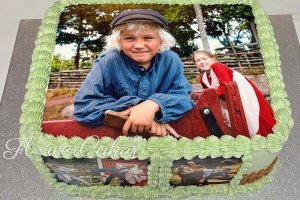 Tårta dekorerad med bilder av Emil i Lönneberga.